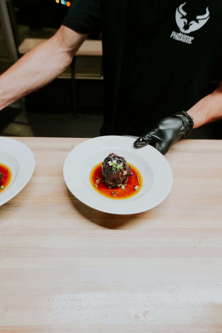 Bò kho, smoked oxtail, set down on the pass