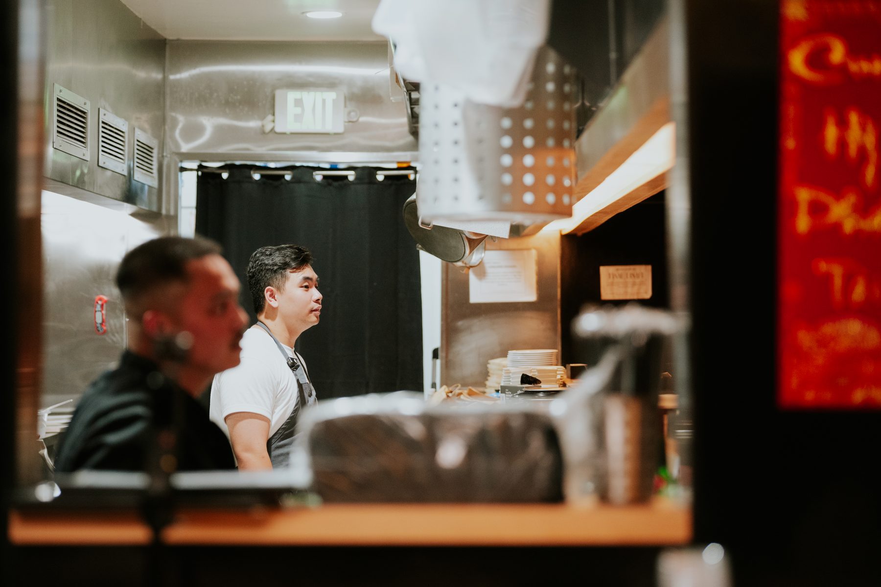 David in the kitchen behind the counter as service runs