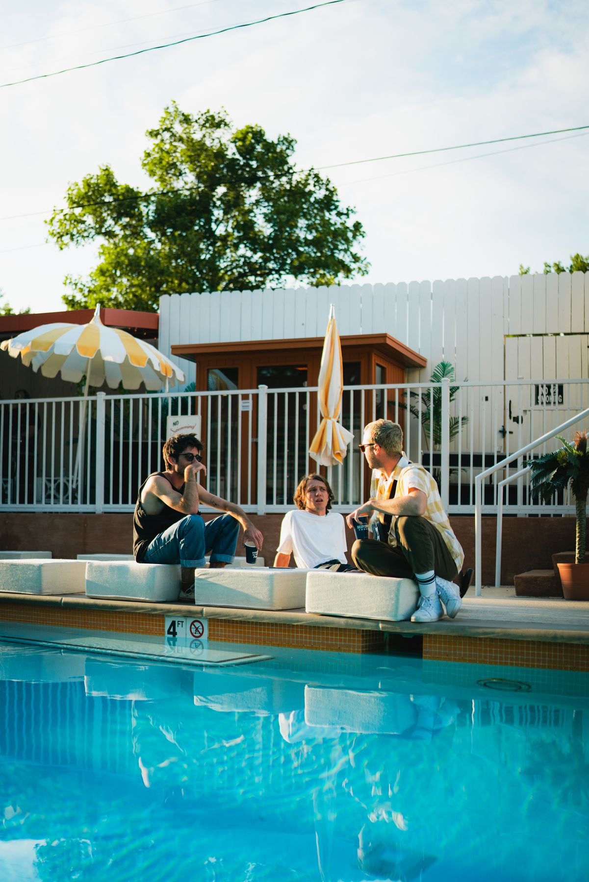 Guests by the pool as the evening starts
